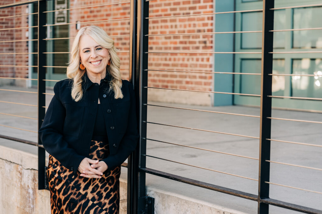 Jo Leda Martin Christian Counselor posed smiling in front of building