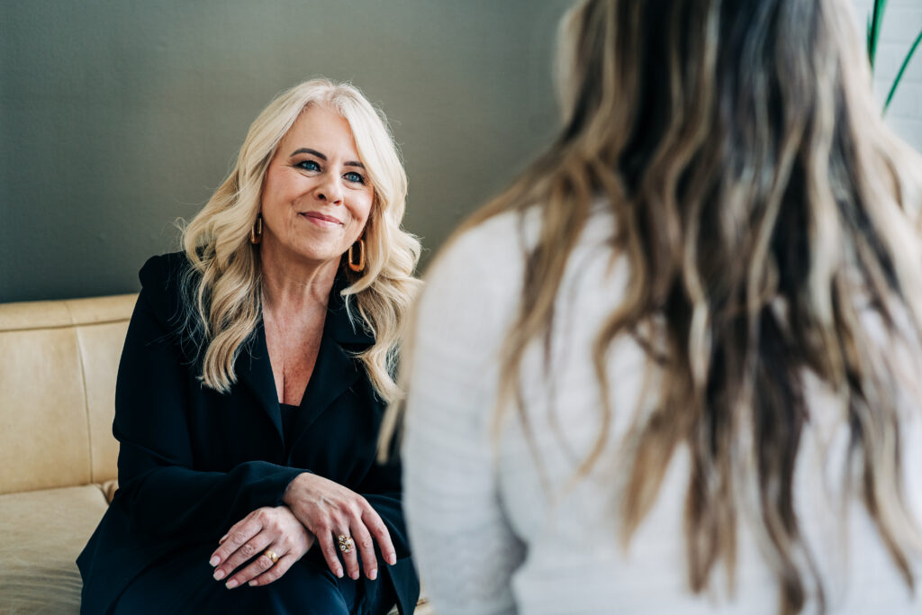 Jo Leda Martin Counselor in a a counseling session listening to client who is experiencing something heavy